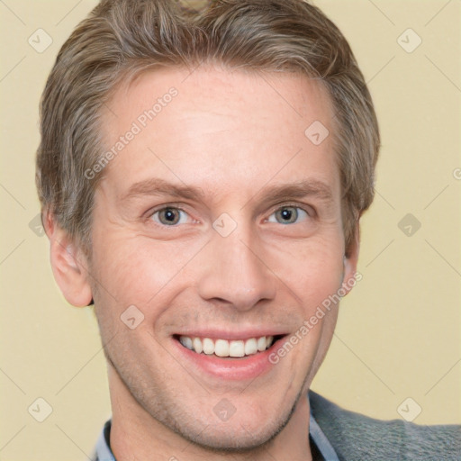 Joyful white adult male with short  brown hair and grey eyes