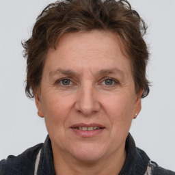 Joyful white adult female with short  brown hair and grey eyes