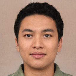 Joyful asian young-adult male with short  black hair and brown eyes