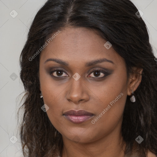 Joyful black young-adult female with long  brown hair and brown eyes