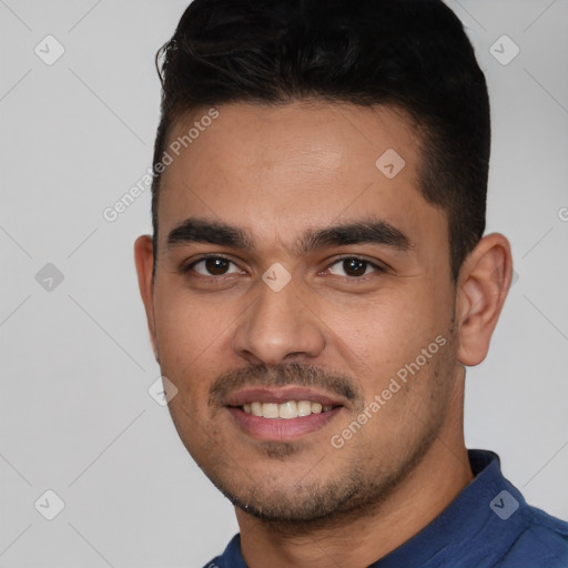 Joyful white young-adult male with short  black hair and brown eyes