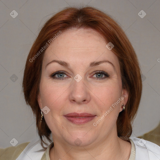 Joyful white adult female with medium  brown hair and blue eyes