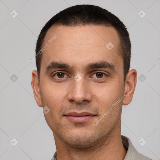 Joyful white young-adult male with short  black hair and brown eyes