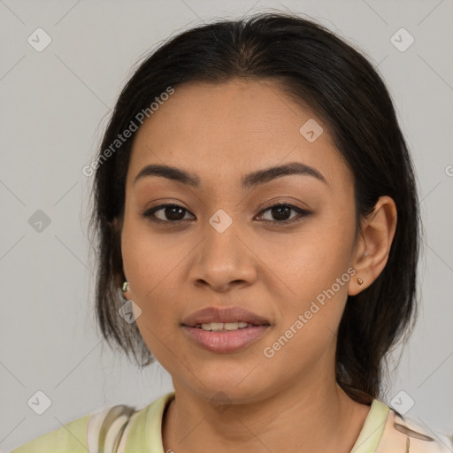 Joyful latino young-adult female with medium  brown hair and brown eyes