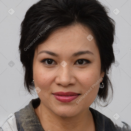 Joyful latino adult female with medium  brown hair and brown eyes