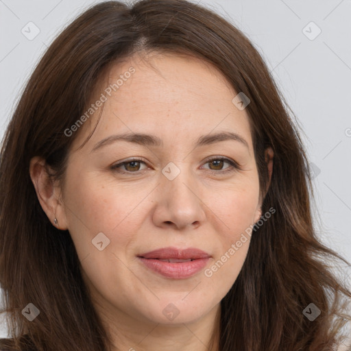 Joyful white adult female with long  brown hair and brown eyes