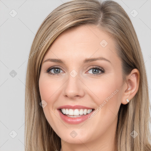 Joyful white young-adult female with long  brown hair and grey eyes