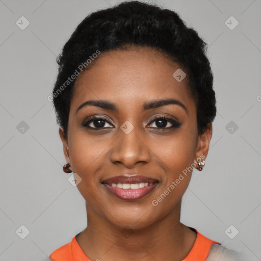 Joyful black young-adult female with short  black hair and brown eyes