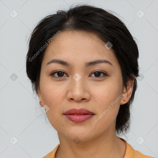 Joyful asian young-adult female with medium  brown hair and brown eyes