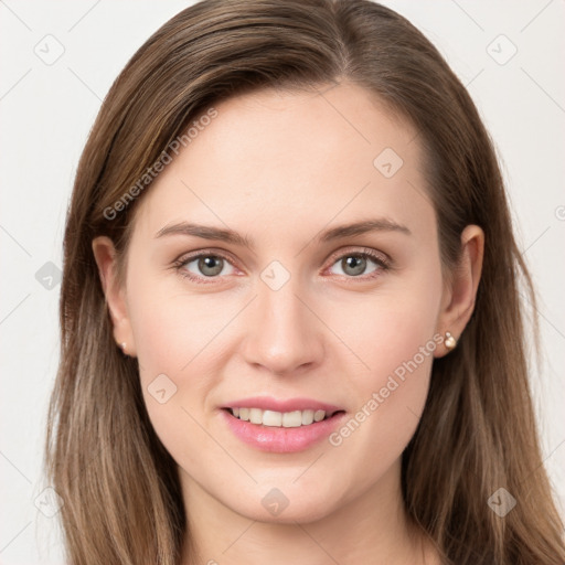 Joyful white young-adult female with long  brown hair and grey eyes