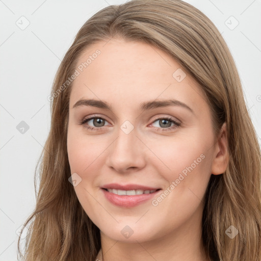 Joyful white young-adult female with long  brown hair and grey eyes