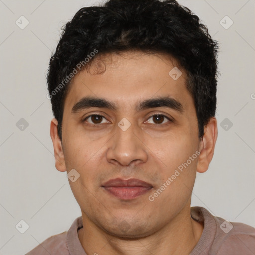 Joyful latino young-adult male with short  black hair and brown eyes