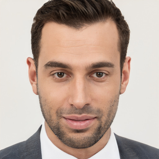 Joyful white young-adult male with short  brown hair and brown eyes