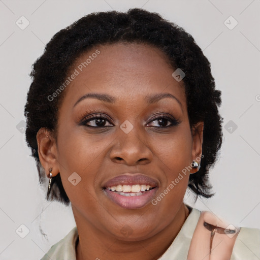 Joyful black adult female with medium  brown hair and brown eyes