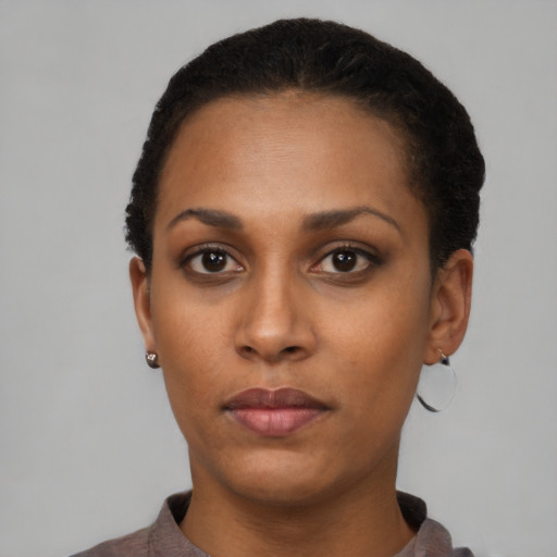 Neutral latino young-adult female with short  black hair and brown eyes