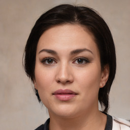 Joyful white young-adult female with medium  brown hair and brown eyes