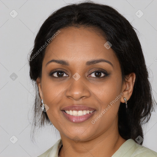 Joyful black young-adult female with medium  brown hair and brown eyes