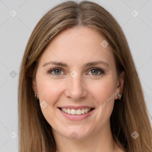 Joyful white young-adult female with long  brown hair and grey eyes