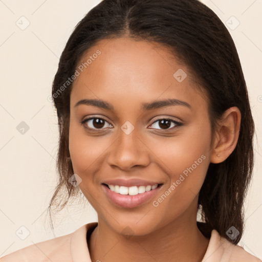 Joyful latino young-adult female with long  brown hair and brown eyes