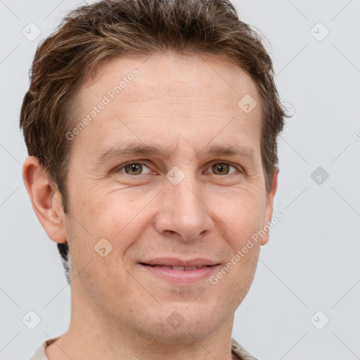 Joyful white adult male with short  brown hair and grey eyes