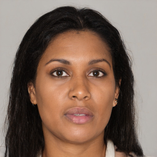 Neutral black young-adult female with long  brown hair and brown eyes