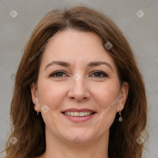 Joyful white adult female with medium  brown hair and grey eyes