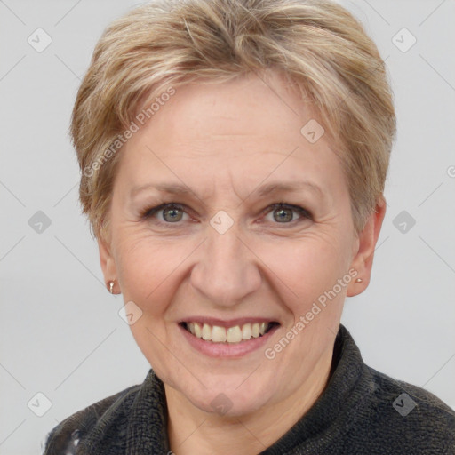 Joyful white adult female with short  brown hair and grey eyes