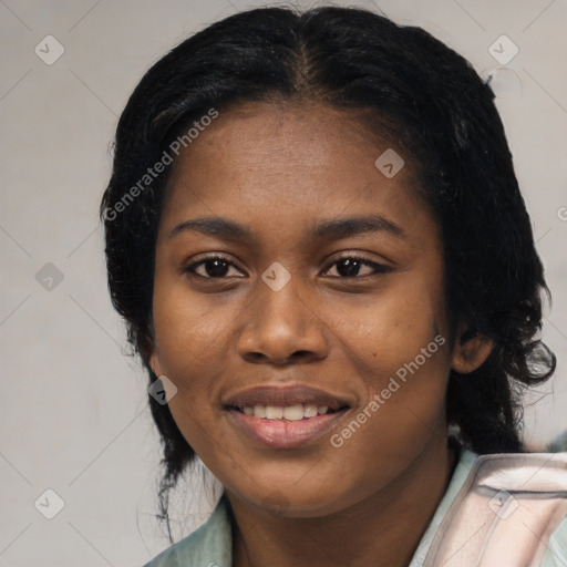 Joyful black young-adult female with medium  black hair and brown eyes