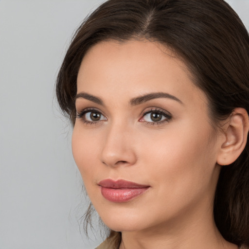 Neutral white young-adult female with long  brown hair and brown eyes