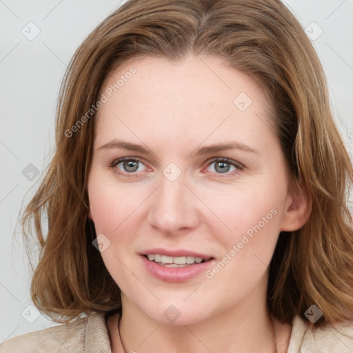 Joyful white young-adult female with medium  brown hair and blue eyes