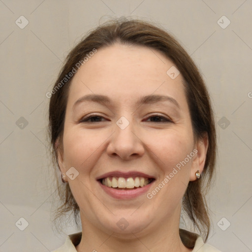 Joyful white adult female with medium  brown hair and grey eyes