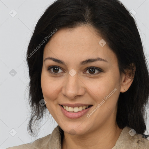 Joyful latino young-adult female with medium  brown hair and brown eyes