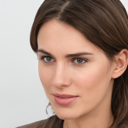 Neutral white young-adult female with long  brown hair and brown eyes