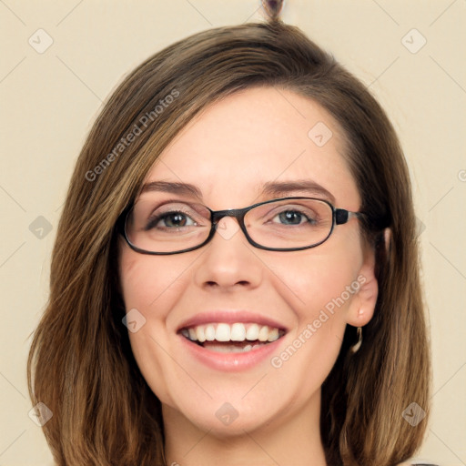 Joyful white young-adult female with long  brown hair and green eyes