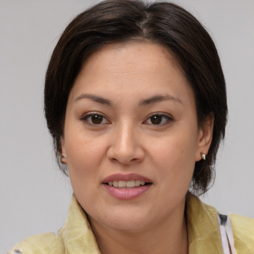 Joyful white adult female with medium  brown hair and brown eyes