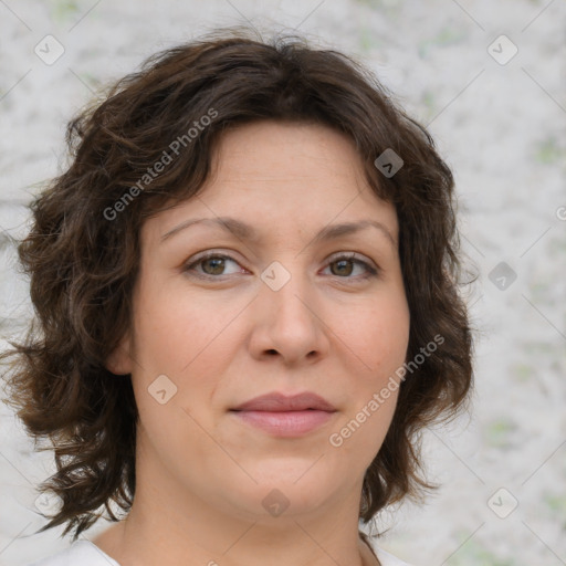 Joyful white young-adult female with medium  brown hair and green eyes