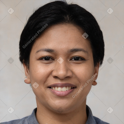 Joyful latino young-adult female with short  black hair and brown eyes