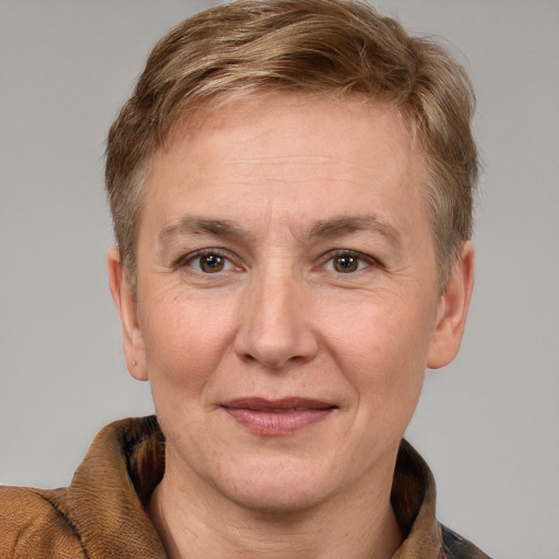 Joyful white adult female with short  brown hair and grey eyes