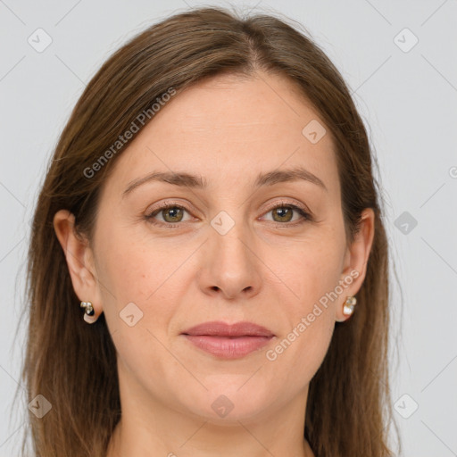 Joyful white adult female with long  brown hair and grey eyes