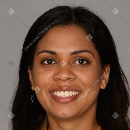 Joyful black young-adult female with long  brown hair and brown eyes