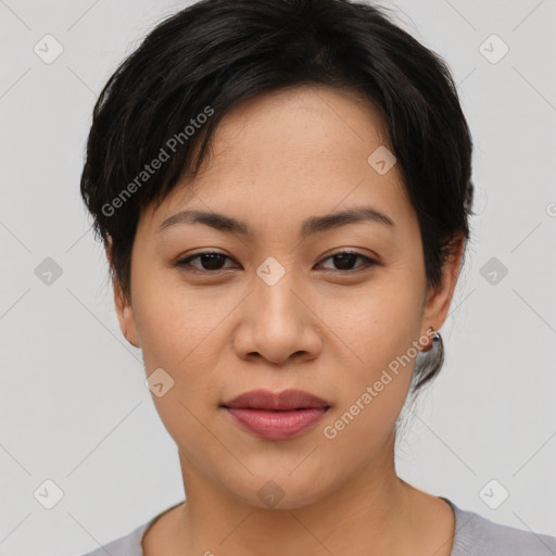 Joyful asian young-adult female with short  black hair and brown eyes