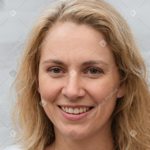 Joyful white adult female with long  brown hair and brown eyes