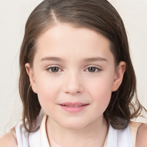 Joyful white child female with medium  brown hair and brown eyes