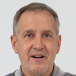 Joyful white middle-aged male with short  gray hair and brown eyes