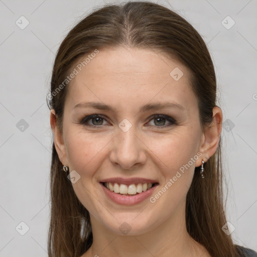 Joyful white young-adult female with long  brown hair and grey eyes