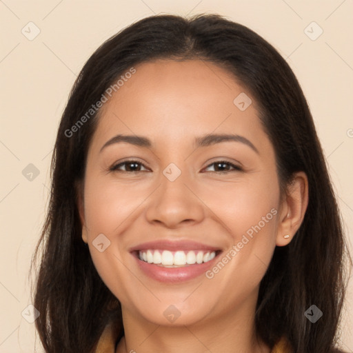 Joyful latino young-adult female with long  brown hair and brown eyes