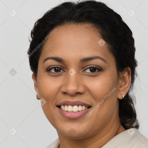 Joyful latino young-adult female with short  brown hair and brown eyes