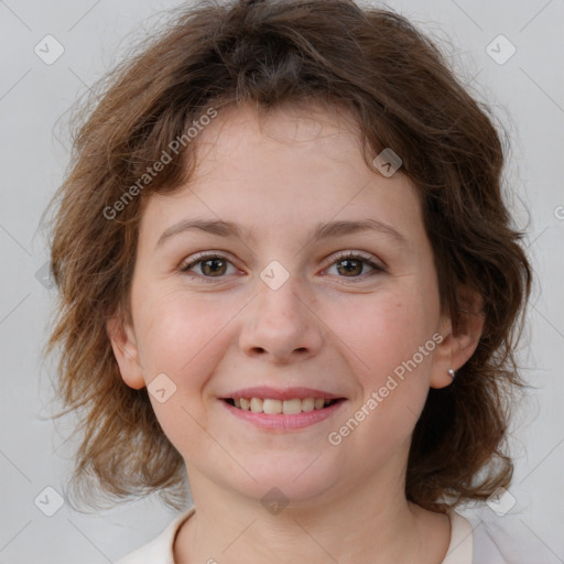 Joyful white child female with medium  brown hair and brown eyes