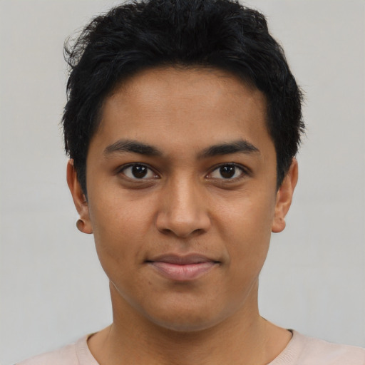 Joyful asian young-adult male with short  black hair and brown eyes