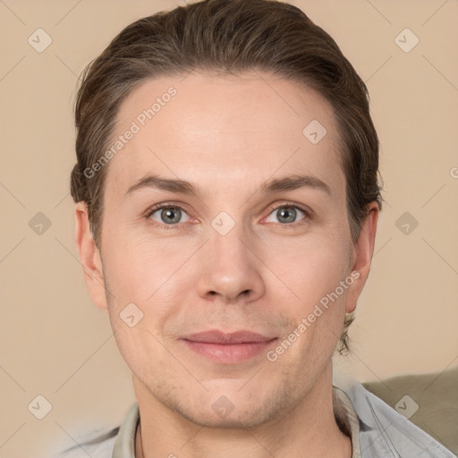 Joyful white adult male with short  brown hair and grey eyes